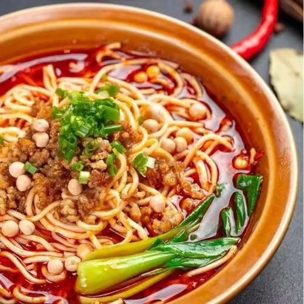 Sichuan spicy minced pork noodle soup with peanuts and bok choy at Noodles + BBQ, a Chinese Restaurant in Los Angeles